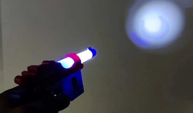 “Super spinning space toy gun with projection feature, lights, and sounds for children”