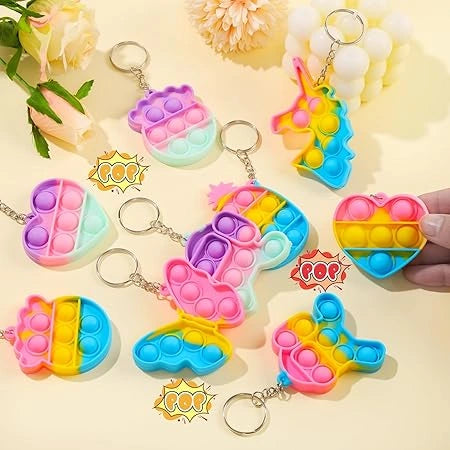 "Set of 10 colorful silicone pop keychain fidget toys for kids, stress relief and party bag fillers, perfect for birthdays, classroom rewards, and gifts."
