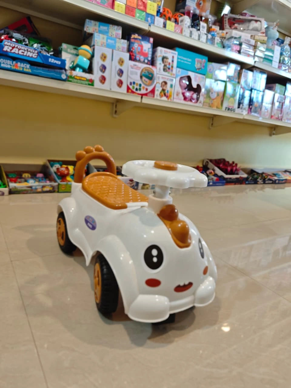 Electric ride-on toy car for kids with music, lights, and rechargeable battery — designed for safe and fun driving experience for children aged 3 to 8 years.
