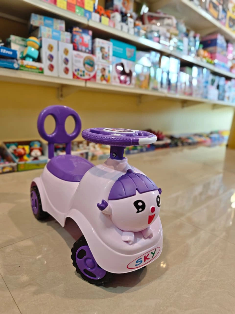 Electric ride-on toy car for kids with music, lights, and rechargeable battery — designed for safe and fun driving experience for children aged 3 to 8 years.