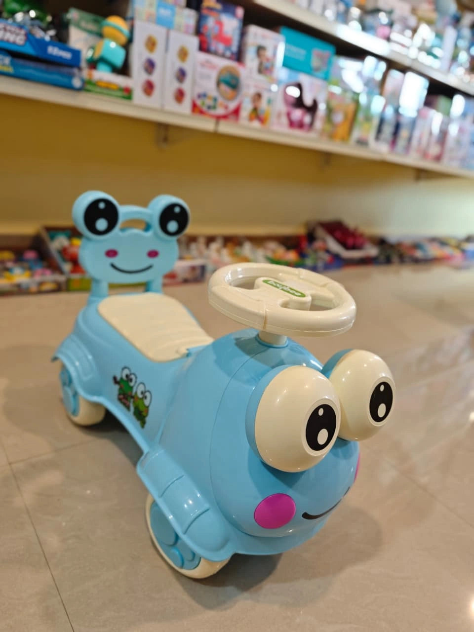 Electric ride-on toy car for kids with music, lights, and rechargeable battery — designed for safe and fun driving experience for children aged 3 to 8 years.