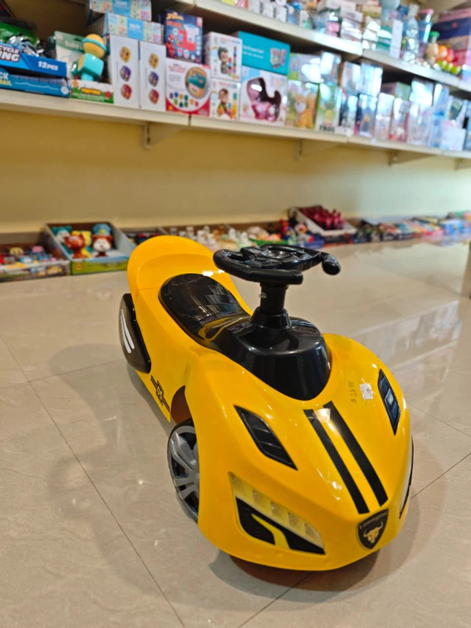 Electric ride-on toy car for kids with music, lights, and rechargeable battery — designed for safe and fun driving experience for children aged 3 to 8 years.